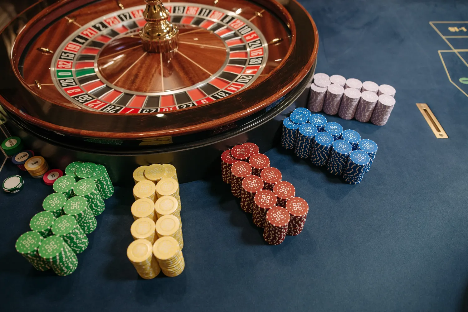 Roulette wheel and high-stakes chips close-up